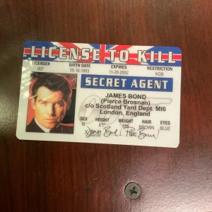 BOND James Bond license to kill card with red and white border, black hair silhouette, and “SECRET AGENT” text.