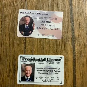 Biden Presidential Permit #46-01 with blue eyes, white hair, Philadelphia PA 19102 address on gold background.
